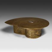 An exceptional ammonite-shaped coffee table by Marc Dhaenens, etched brass tabletop with a workd-in