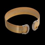 A Cartier Ressort 'Double C' bracelet in 18ct tri-color gold and diamonds, weight: 29,6 g (+)