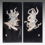 Two Japanese shibayama inlaid black lacquer panels, depicting two gods of good fortune with dragons,
