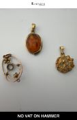 Three 9ct Gold Pendants: Amber Cabochon, Abstract, and Art Nouveau Style