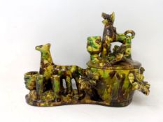 An Ottoman Turkey splashware pottery box and cover, applied a horse, a tiger/lion and foliage, 18 cm