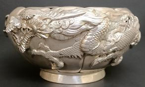 A Japanese silver coloured metal bowl, decorated a dragon, with inner liner, 16.8 ozt all in, 17