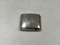 A silver cigarette case,