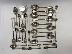 A collection of silver flatware,