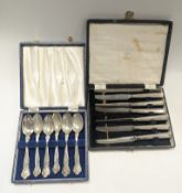 A cased set of silver spoons, together with a set of knives,
