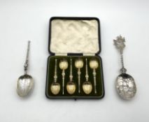 A collection of silver spoons,