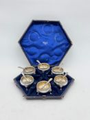 A cased set of six Victorian silver salts with spoons,
