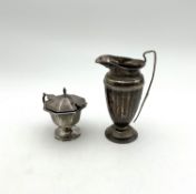 A silver cream jug, together with a silver salt,