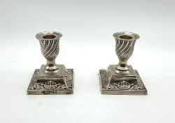 A pair of Victorian silver dwarf candlesticks,