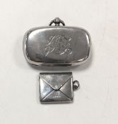 A sovereign case, together with a novelty stamp case,