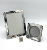 Three silver photograph frames,