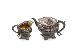 A 19th century silver plated teapot and milk jug,