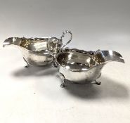A pair of George V silver cream jugs,