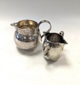 Two silver cream jugs,