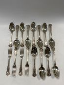 A set of twelve spoons and four forks,