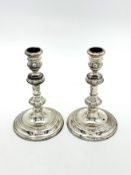 A pair of silver candlesticks,