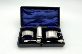 An Edwardian cased three piece condiment set,