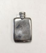 A silver hip flask,