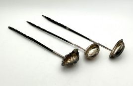 Three silver ladles,