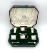A George VI silver six piece cruet set with three additions,