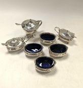 A set of four salts, together with mustard pots,