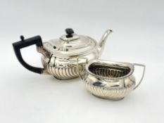 A Victorian silver teapot and sugar bowl,
