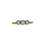 An early 20th century three stone diamond ring, size M, unhallmarked, stamped '18CT & PT', weight