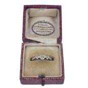 A three stone diamond heart shaped ring, size L½, unhallmarked, stamped '18CT & PLAT', weight 1.8g