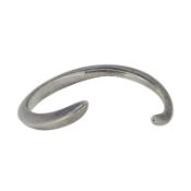 Sarah Jordan - A silver bangle, inside diameter 5.3cm, hallmarked silver with makers mark, weight