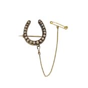 A split pearl horseshoe brooch, dimensions 2.5 x 2.2cm, unmarked, tested as 9ct gold, weight 5.9g
