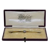An early 20th century diamond set daisy style brooch, length 7.6cm, pin and revolver fitting,