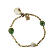 A belcher style bracelet with baroque pearls and emerald cabochons, length 18cm, bolt ring clasp