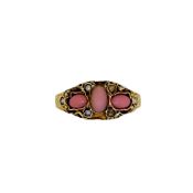 A late Victorian 15ct gold coral ring with imitation pearls (2 lacking), width 8.9mm, carved