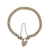 A curb link bracelet with a padlock clasp, length 16cm, unhallmarked, stamped '9CT', weight 5.1g
