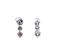 A pair of three stone diamond earrings, length 1.3cm stamped '9K', weight 1.8g