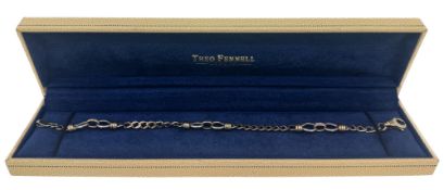 A 9ct two colour gold bracelet, length 20cm, hallmarked 9ct gold, weight 14.4g, cased by Theo