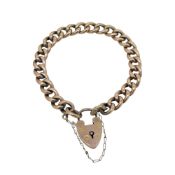 A curb link bracelet with a padlock fitting, length 16cm, hallmarked 9ct gold, weight 10.6g