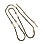 A rope style chain with ivory spacers, length 74cm, later push-in clasp, unhallmarked, stamped '