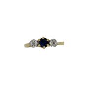 A sapphire and diamond three stone ring, size M, unhallmarked, stamped '18CT', weight 2.1g