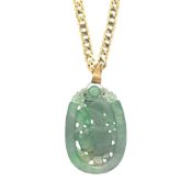 A carved jade pendant and chain, length of pendant including bale 6.5cm, width 3.6cm, bale unmarked,