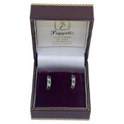 A pair of emerald and diamond half hoop style earrings, stamped '14K', (one scroll fitting