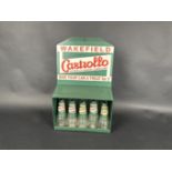 Castrollo, a recreated wall mounted oil jar dispensing cabinet c/w oil jars, pourers and recreated