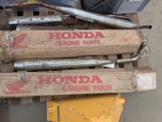 Qty Honda Cub motorcycle exhaust silencers, some NOS in box