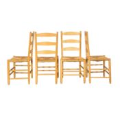 Manner of Gordon Russell Four ladderback dining chairs 