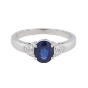 A sapphire and diamond ring White metal