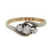 A diamond three stone ring Yellow and white metal