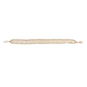 A rice pearl bracelet Yellow metal