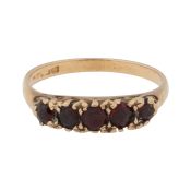 A garnet five stone ring 9ct yellow gold