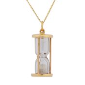 An hourglass pendant necklace Yellow metal