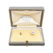 A sapphire and mother of pearl dress stud Yellow and white metal